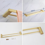 Elegantes Badezimmer-Set mit goldenen Handtuchhaltern