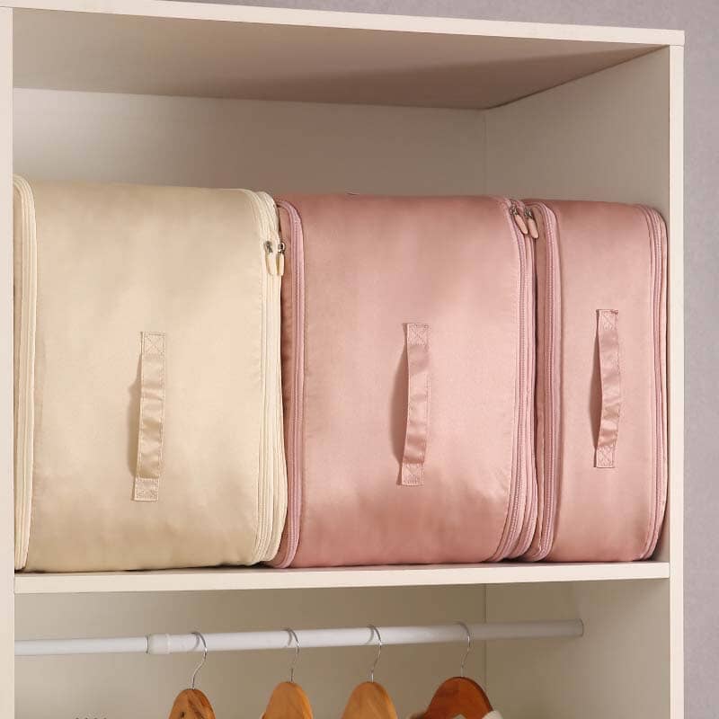 Space-saving, self-compressing storage bag