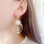 Drei-Ring Ohrstecker in Kristall-Lotus-Design
