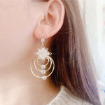 Drei-Ringe Ohrringe mit Kristall-Lotus