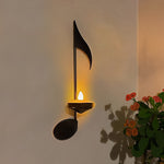 Wandlicht mit schwarzer Musiknote