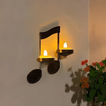 Wandlicht mit schwarzer Musiknote