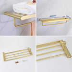 Elegantes Badezimmer-Set mit goldenen Handtuchhaltern
