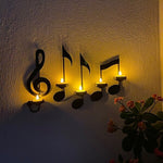 Wandlicht mit schwarzer Musiknote