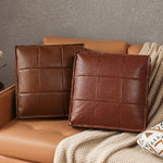 Eleganter Sitzpouf aus Kunstleder mit modernem Gitterdesign