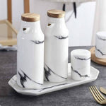 Elegant ceramic kitchen set with spice shakers and oil and vinegar dispensers