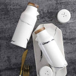 Elegant ceramic kitchen set with spice shakers and oil and vinegar dispensers
