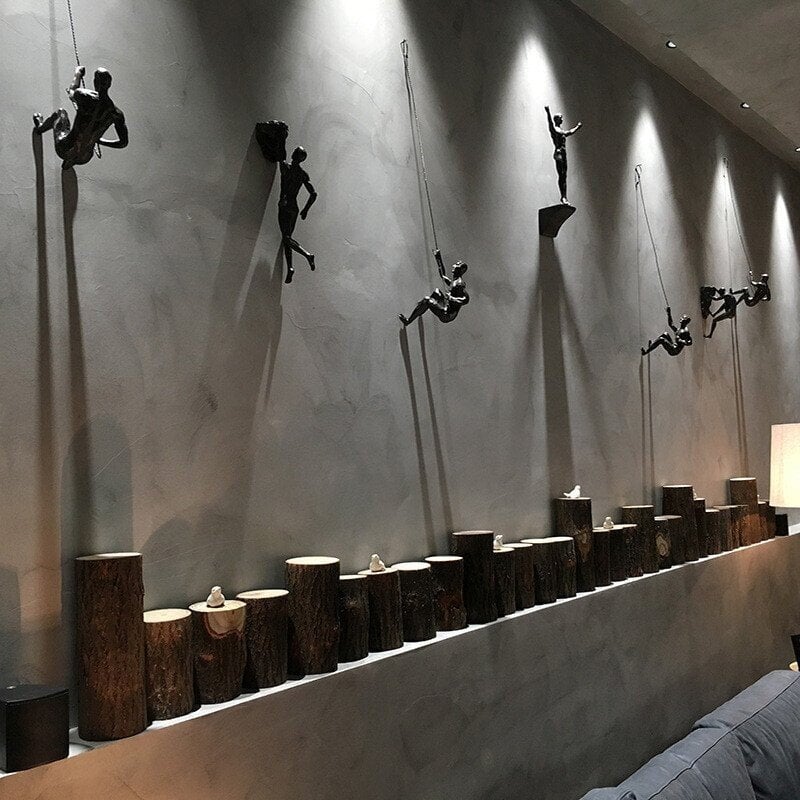 Skulptur des Kletterers