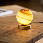 Stylish table lamp with marble sphere and brass base – Perfect lighting for bedroom and desk