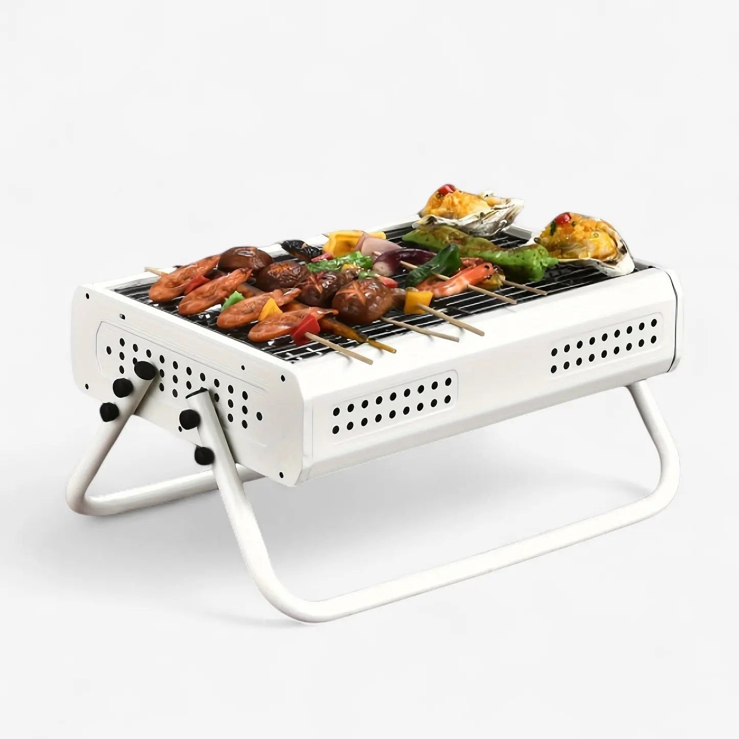 Kompakter Holzkohlegrill mit Klappgriffen für einfache Nutzung