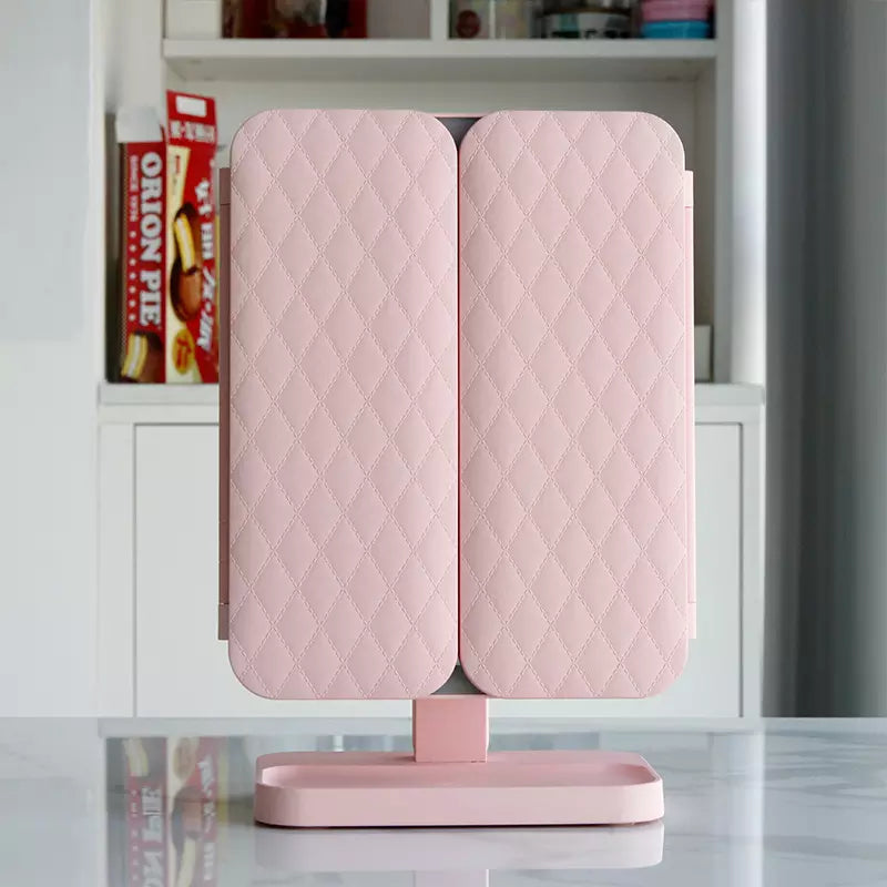 Illuminated cosmetic mirror with adjustable angle