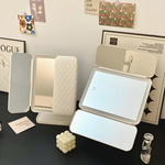 Illuminated cosmetic mirror with adjustable angle