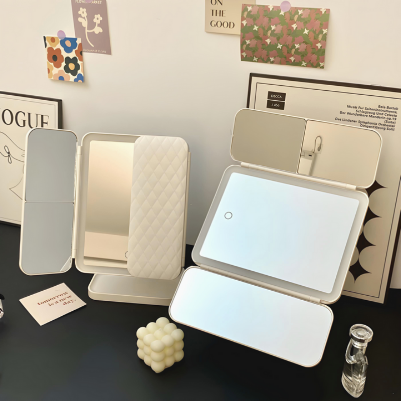 Illuminated cosmetic mirror with adjustable angle
