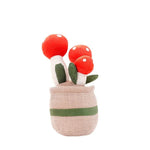 Plüschfigur mit fröhlichem Blumendesign