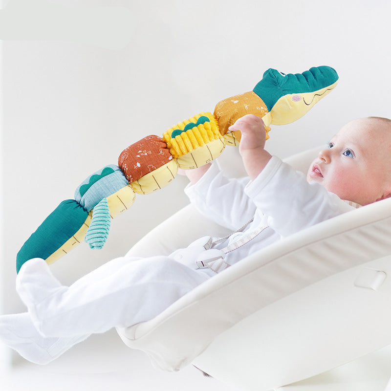 Musikalisches Krokodil mit sensorischem Plüsch und Rassel