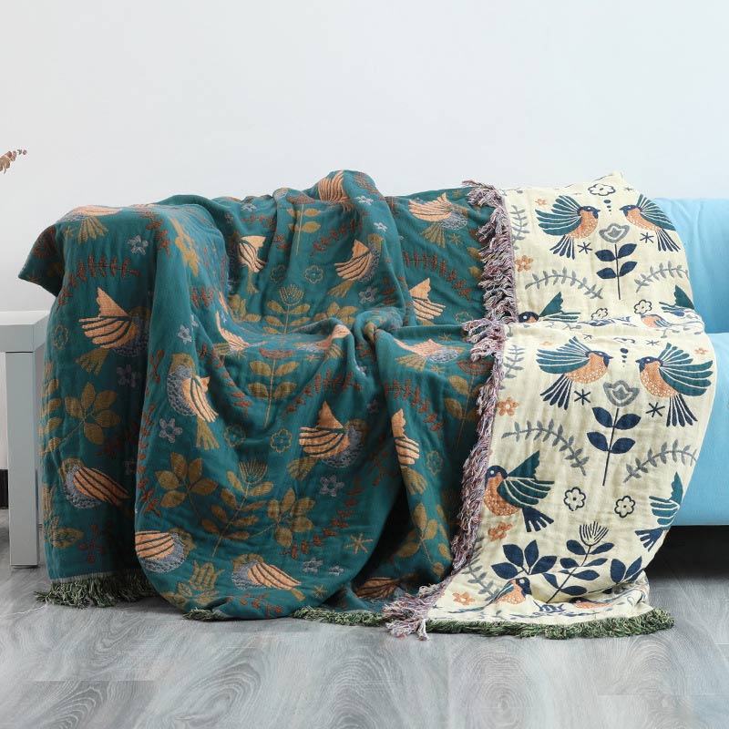 Reversible cotton blanket with floral and bird motif