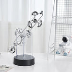 Kinetische Eleganz | Rotierendes Pendel Ornament