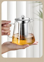 Elegant teapot made of heat-resistant glass with a stainless steel filter