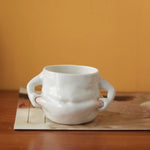 Die charmante Kaffeetasse mit lustigen Griffen