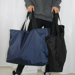 Praktische Faltbare Reisetasche – 4 Größen, Schwarz oder Blau