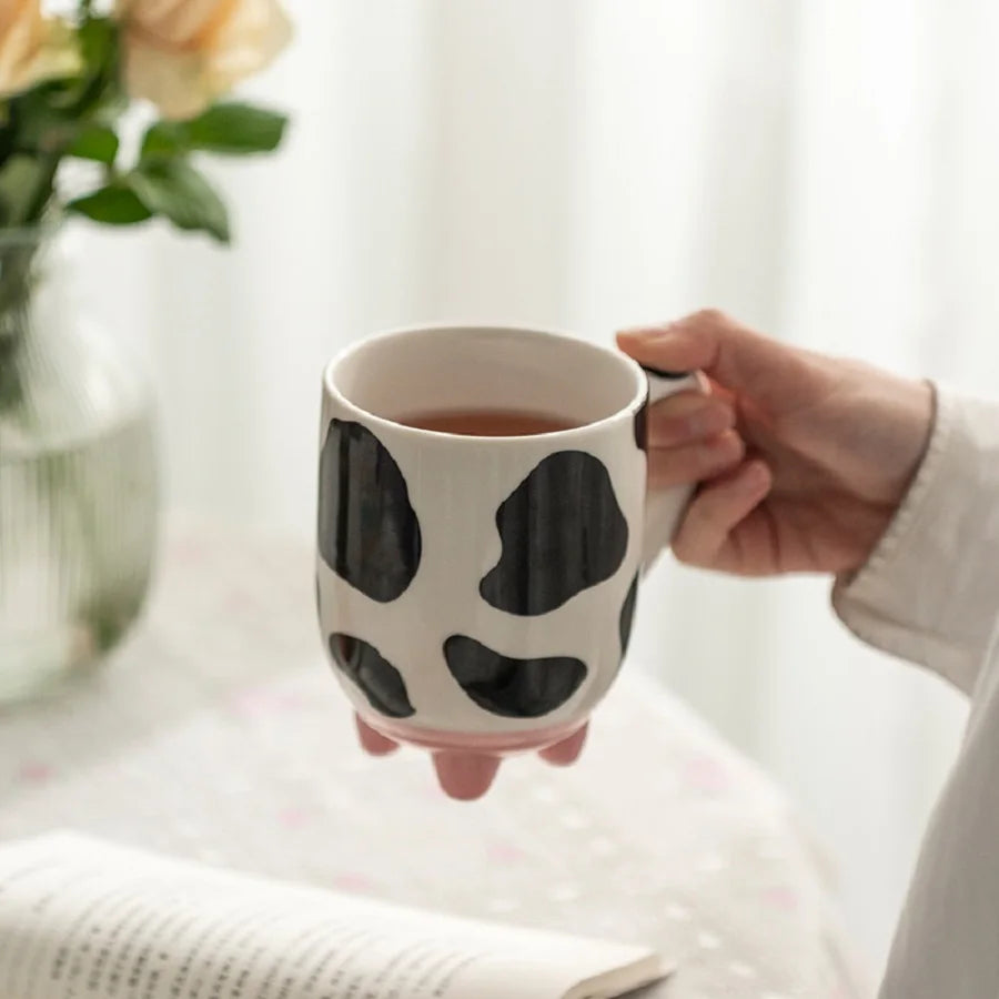 Lustige Milchkanne: Kaffeetasse mit Kuhdesign