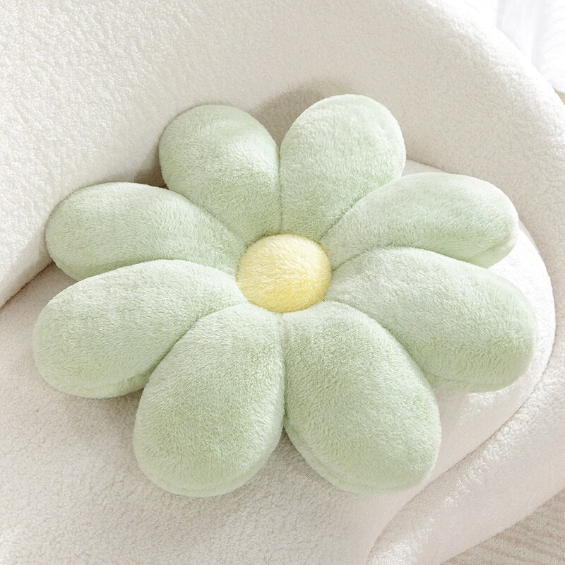 Pastellfarbiges Kissen mit flauschigem Gänseblümchenmuster
