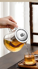 Elegant teapot made of heat-resistant glass with a stainless steel filter