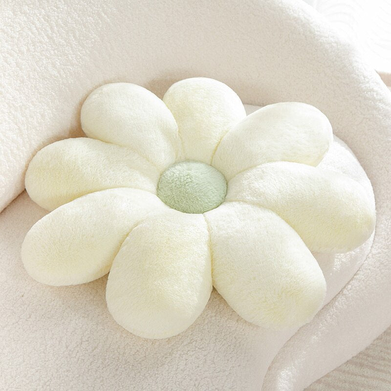 Pastellfarbiges Kissen mit flauschigem Gänseblümchenmuster