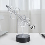 Kinetische Eleganz | Rotierendes Pendel Ornament