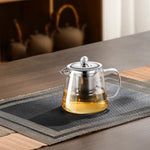 Elegant teapot made of heat-resistant glass with a stainless steel filter