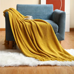Leichte Strickdecke mit Quasten – Stilvolle Kuscheldecke für Ihr Zuhause
