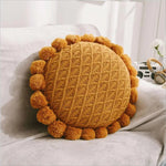 Runder Kuschelkissen mit Pompom und Quaste aus Acrylstrick