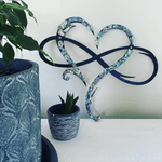 Wanddekoration InfinityHerz – Eisen Skulptur mit Symbol der ewigen Liebe