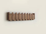 Elegant wooden wall coat rack with fold-out hooks