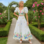 Elegantes Blumendesign: Zweiteiliges Set mit Puffärmeln und Rüschensrock
