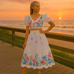 Elegantes Blumendesign: Zweiteiliges Set mit Puffärmeln und Rüschensrock
