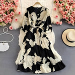 Leichtes Sommerkleid aus Chiffon mit V-Ausschnitt und Puffärmeln