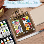 Kompaktes Aquarellset für Reisen mit Palette, Pinsel und Skizzenbuch