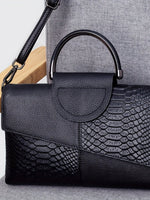 Stylish shoulder bag in elegant crocodile pattern
