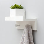 Elegant Wall Shelf with Hooks for Optimal Storage Space