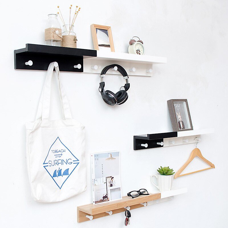 Elegant Wall Shelf with Hooks for Optimal Storage Space