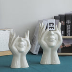 Keramische Blumenvase mit abstraktem menschlichen Gesicht