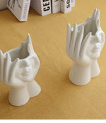 Keramische Blumenvase mit abstraktem menschlichen Gesicht