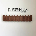 Elegant wooden wall coat rack with fold-out hooks