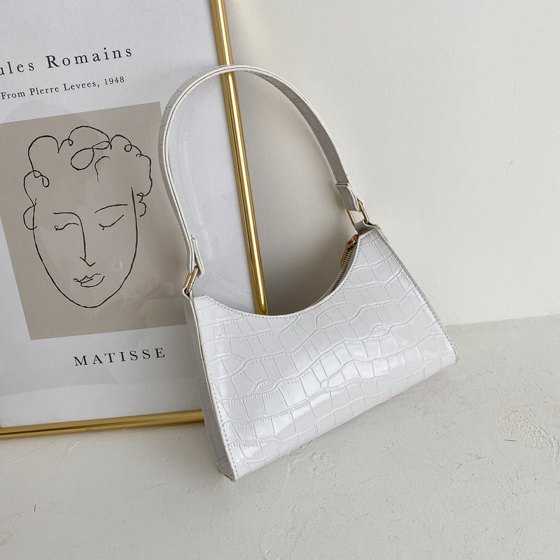 Elegant baguette bag in a stylish snake look