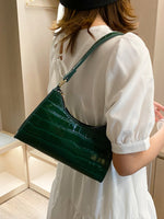Elegant baguette bag in a stylish snake look