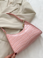 Elegant baguette bag in a stylish snake look