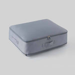 Space-saving, self-compressing storage bag