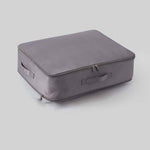 Space-saving, self-compressing storage bag