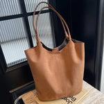 Luxurious suede bag with plenty of storage for any occasion